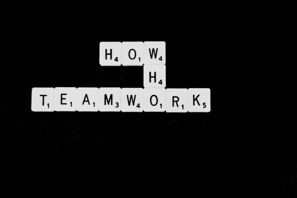 An image of Scrabble words: who, what, and teamwork